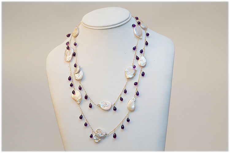 Large flat sweet water pearl and amethyst necklace.