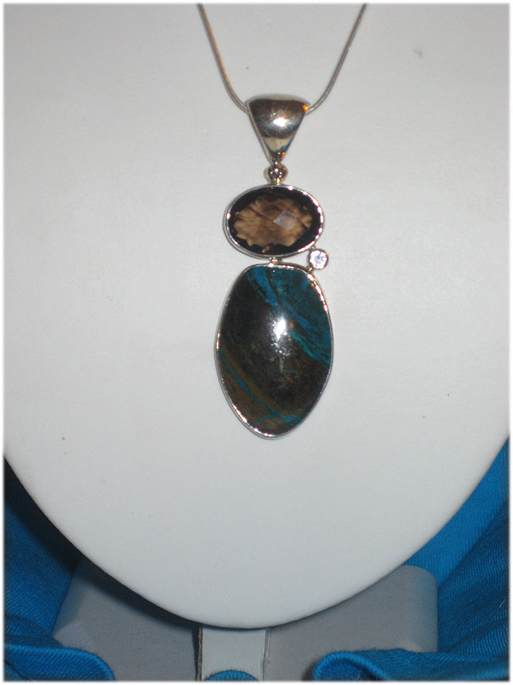 turquoise,smokey quartz and zircon pendant on sterling chain.